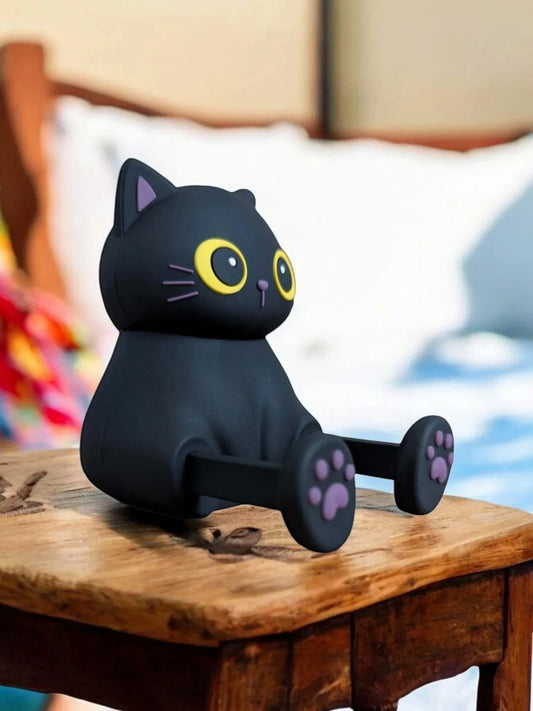 Mini Portable Speaker - Black Cat with Bluetooth v5.2 and phone stand on a table.