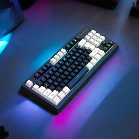 RGB 87-Key Wired Gaming Keyboard with colorful lighting and ergonomic keycaps on a desk setup.